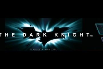 The Dark Knight title logo with the bat emblem glowing behind the lettering, taken from the game's own title screen